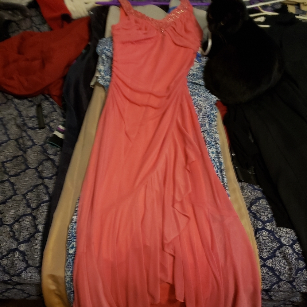 Prom dress. Size medium. Color is pink. I don't know the brand.